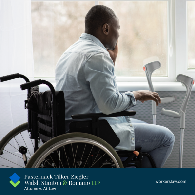 Looking forlornly out the window, an injured man sits in a wheelchair